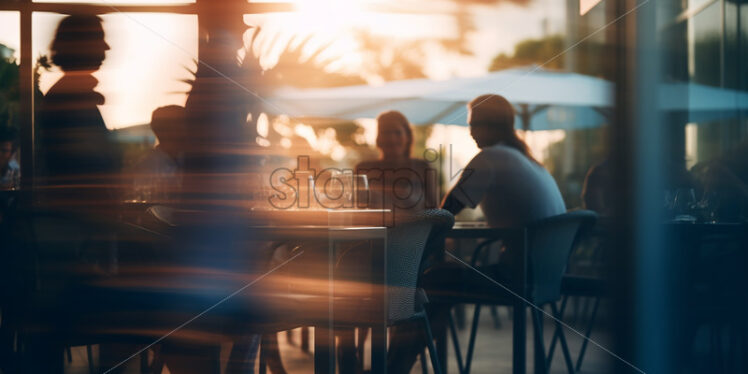 The blurred silhouettes of some people in a restaurant - Starpik