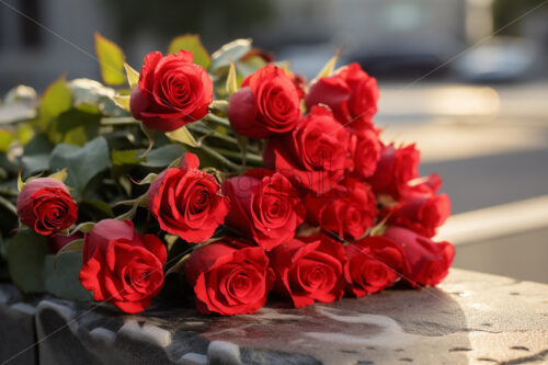 A beautiful bouquet of red roses on a stone surface - Starpik Stock