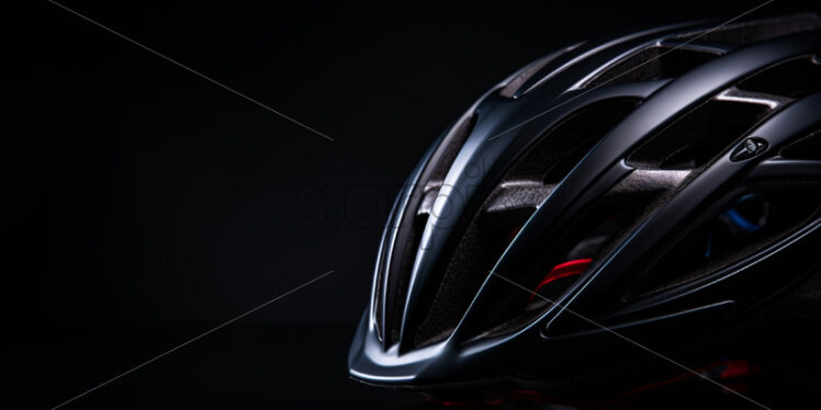 A bicycle helmet on a black background - Starpik Stock