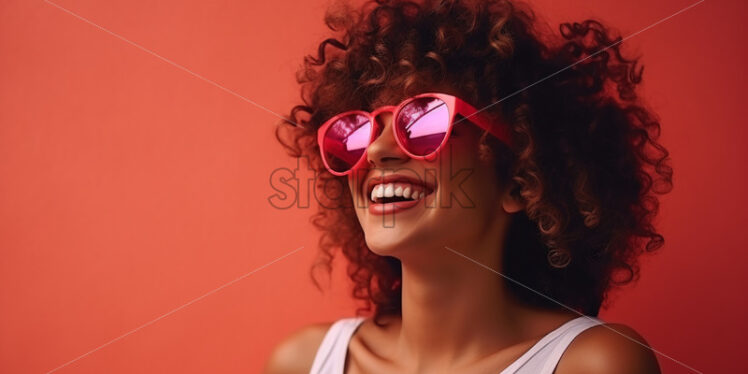 A girl with curly hair and pink glasses - Starpik Stock