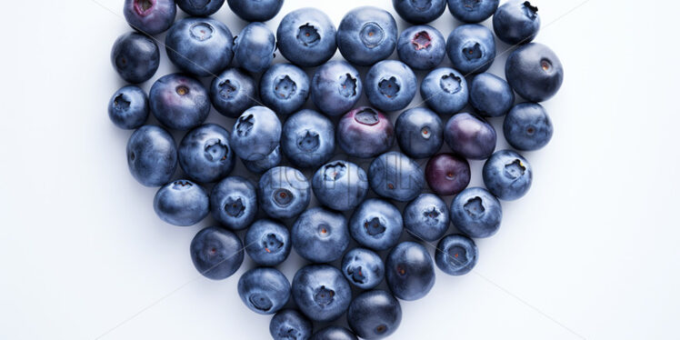 A heart made of blueberries on a white background - Starpik Stock