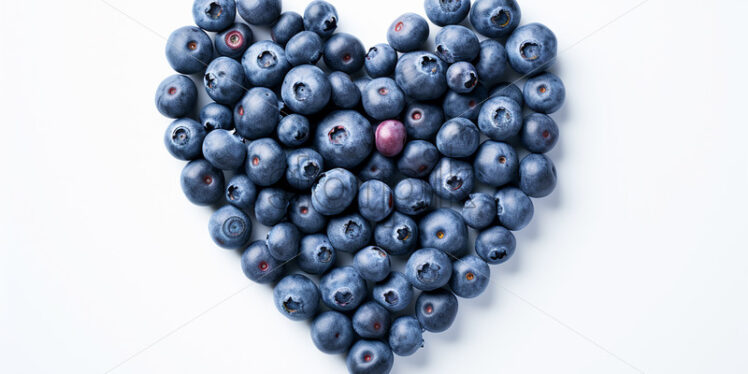 A heart made of blueberries on a white background - Starpik Stock