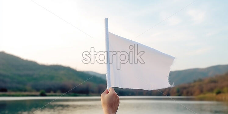 A person holding a white flagellum in his hand - Starpik Stock