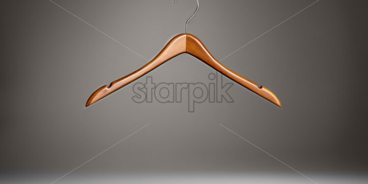 A wooden hanger on a white background - Starpik Stock