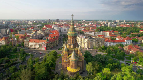 Aerial drone view of Timisoara, Romania. View of the Orthodox Cathedral with historical buildings and greenery around - Starpik