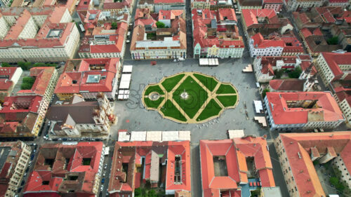 Aerial drone view of Timisoara, Romania. View of the city downtown, Unirii Square with people and multiple historical buildings around - Starpik Stock