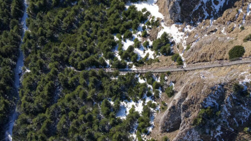 Aerial drone view of Toaca Peak stairs in winter season. Ceahlatu Massif National Park, Romania - Starpik Stock