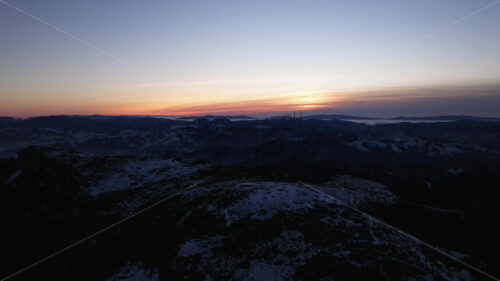 Aerial drone view of sunset in the mountains. Ceahlau National Park, Romania - Starpik Stock