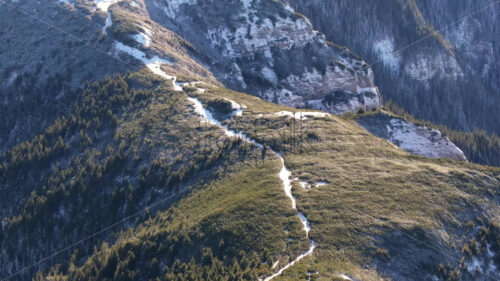 Aerial drone view of winter mountains with fog in Ceahlau National Park, Romania - Starpik Stock