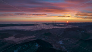 Aerial timelapse drone view of sunrise in Ceahlau National Park, Romania - Starpik