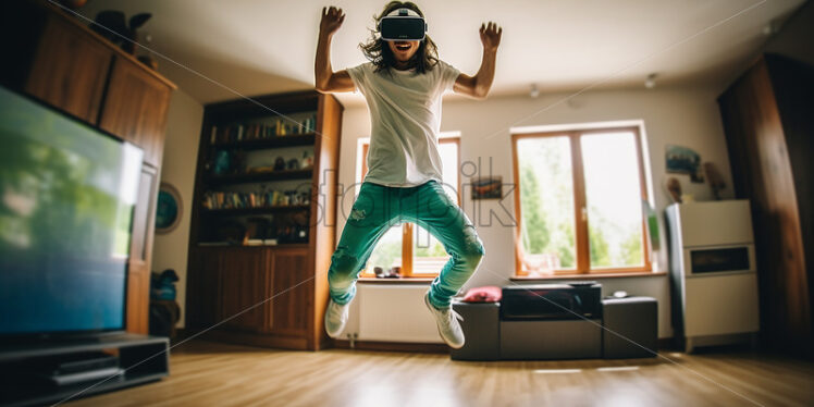 American man happily wearing his virtual reality goggles in their modern living room - Starpik Stock