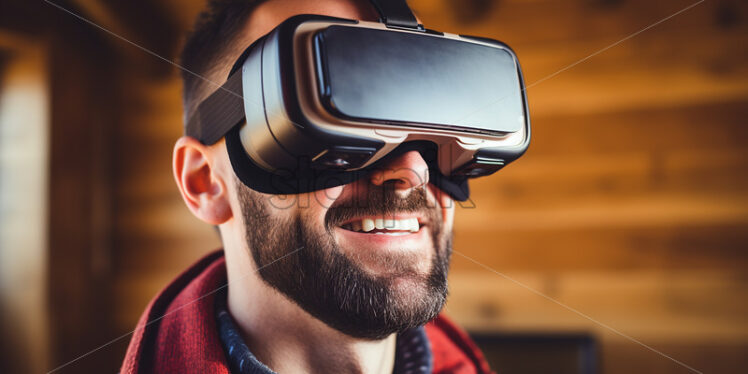 American man happily wearing his virtual reality goggles in their wooden entertainment room - Starpik Stock