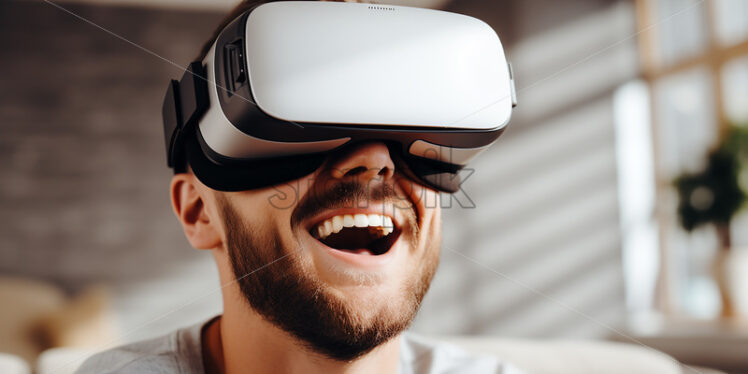 American man overjoyed by wearing his virtual reality goggles in their modern entertainment room  - Starpik Stock