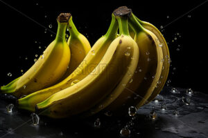 Bananas with splashes of water on them on black background - Starpik