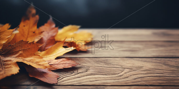 Dry yellow leaves on a wooden table - Starpik Stock