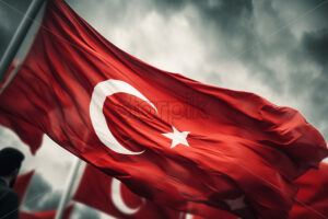 Generative AI a hand holding the Turkish flag and several flags in the background - Starpik Stock