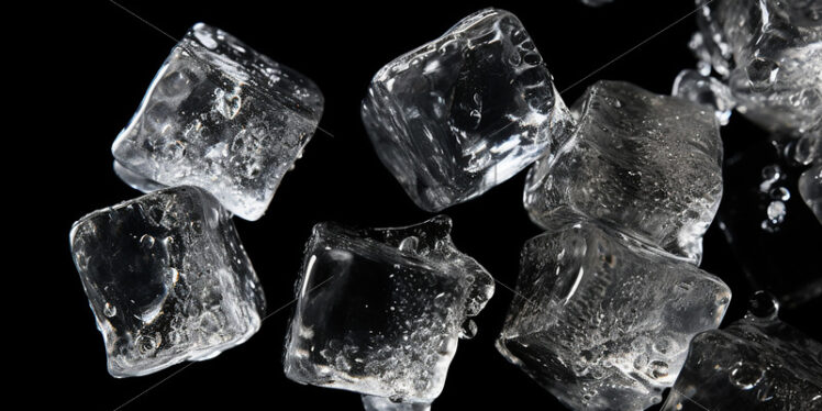 Ice cubes on a black background - Starpik Stock