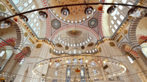 Interior view of the Suleymaniye mosque in Istanbul, Turkey. A lot of illumination, painted ceiling - Starpik Stock