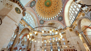 Interior view of the Suleymaniye mosque in Istanbul, Turkey. A lot of illumination, painted ceiling - Starpik Stock