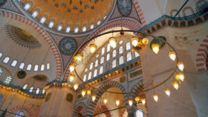 Interior view of the Suleymaniye mosque in Istanbul, Turkey. Illumination, painted ceiling - Starpik Stock