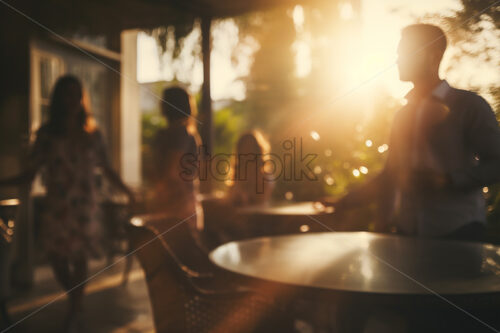 The blurred silhouettes of some people in a restaurant - Starpik Stock