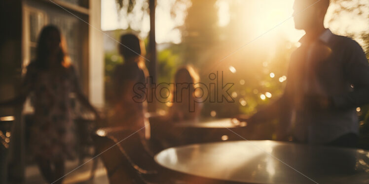 The blurred silhouettes of some people in a restaurant - Starpik Stock