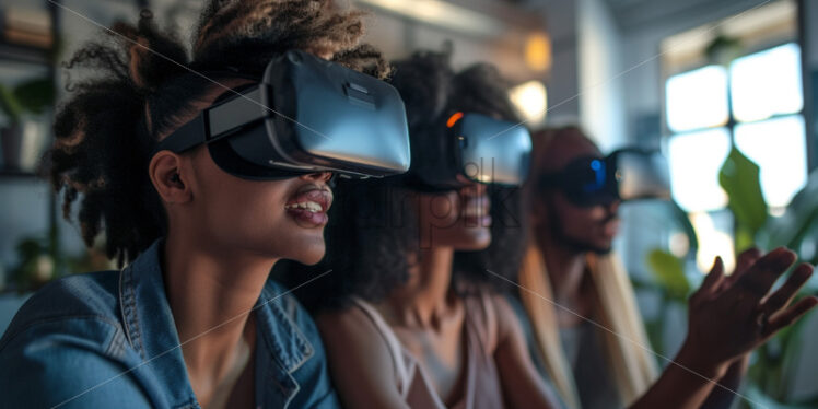 A group of teenagers wearing VR glasses, office concept - Starpik Stock