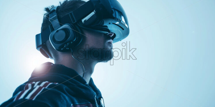 A man watching football game with VR glasses - Starpik Stock