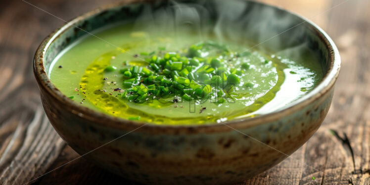 A pea soup on a wooden table - Starpik Stock