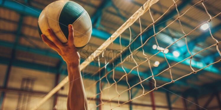 A volleyball player with a volleyball - Starpik Stock