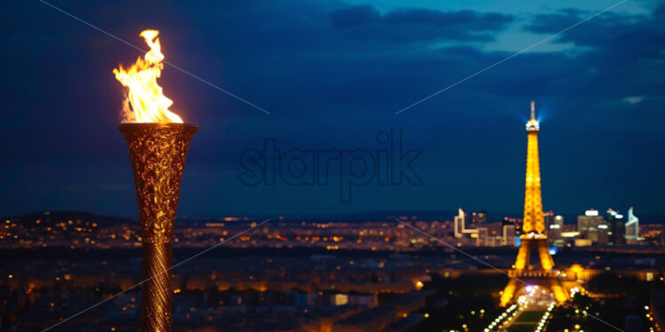 An Olympic torch against the background of the Eiffel Tower - Starpik Stock