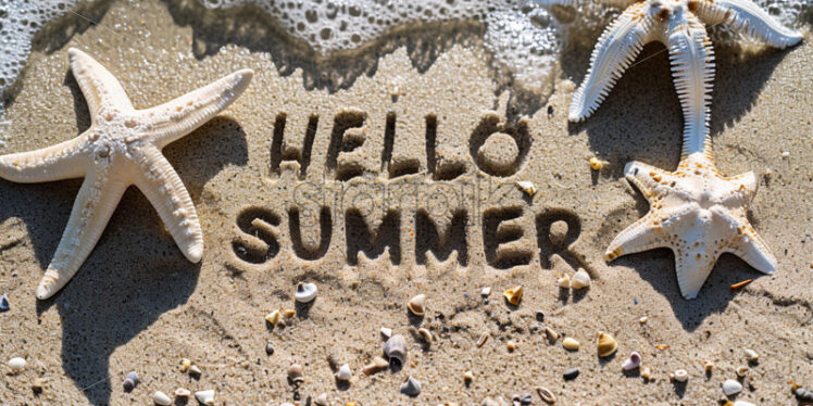 Background of sand and sea, text  HELLO SUMMER is drawn in the sand - Starpik Stock