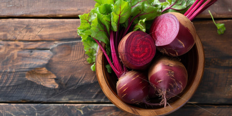 Beetroot in a wooden bowl on a table - Starpik Stock