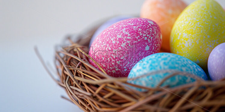 Easter postcard with pastel rainbow eggs in a wicker basket  - Starpik Stock