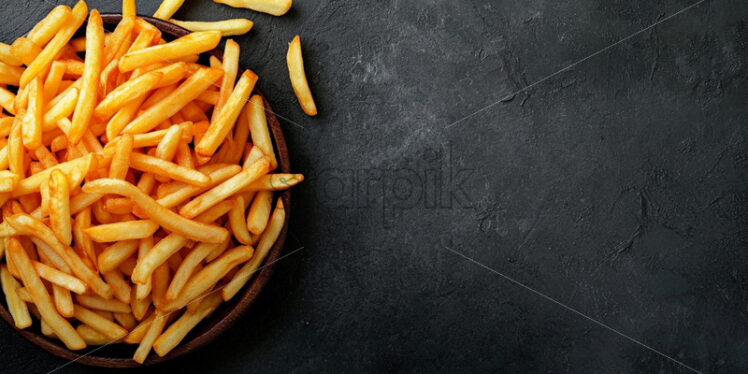 French fries on a gray concrete surface - Starpik Stock