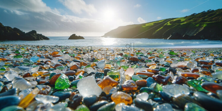 Many pieces of glass bathed in the sun on a beach - Starpik Stock