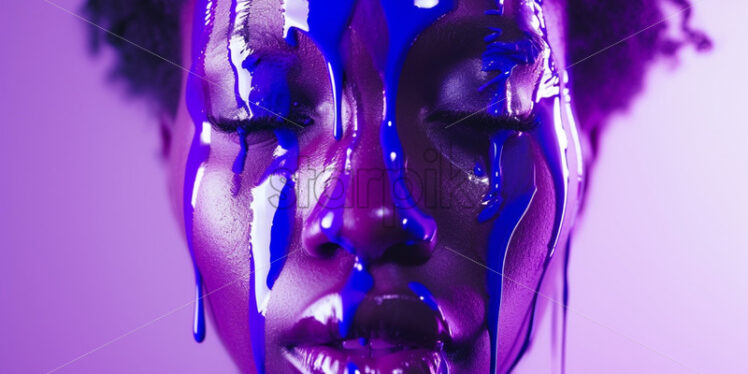 Purple paint pouring on a woman face - Starpik Stock