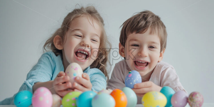 Two happy children are cracking pastel easter eggs - Starpik Stock