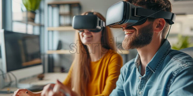 Two people playing with VR glasses in an office - Starpik Stock