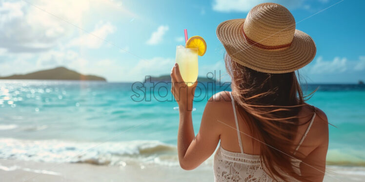 Woman enjoying a cocktail on a tropical island - Starpik Stock