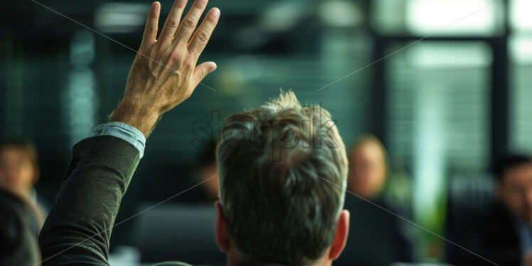 A man in the office with his hand raised - Starpik Stock