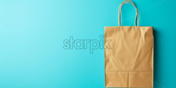 A paper bag on a blue background - Starpik Stock