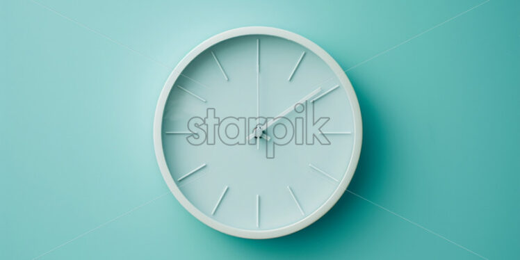 A white clock on a blue wall - Starpik Stock