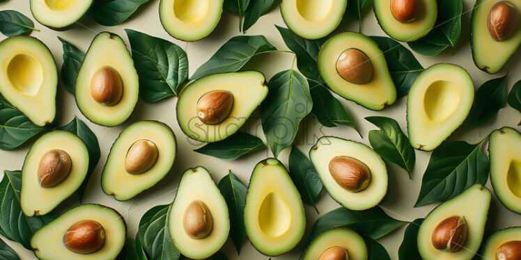 A background with avocado fruits and leaves - Starpik Stock