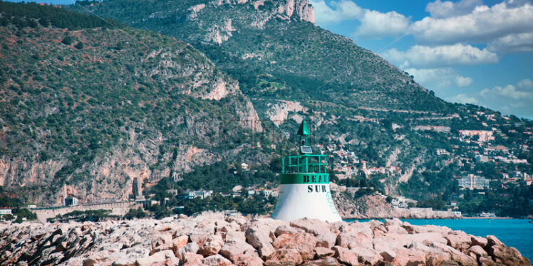 Green and white light house in Beaulieu-sur-Mer - Starpik Stock