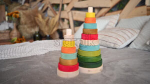 VIDEO Colourful, ecological wooden toys sitting on bed with rustic decor on the background - Starpik