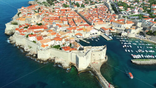 VIDEO Aerial, drone view of buildings on the shore of the Adriatic sea in Dubrovnik, Croatia - Starpik