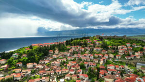 VIDEO Aerial, drone view of houses on the shore of the Aegean Sea in North Macedonia - Starpik