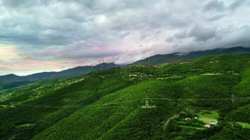 VIDEO Aerial, drone view of mountains and green fields in North Macedonia - Starpik