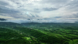 VIDEO Aerial, drone view of mountains and green fields in North Macedonia - Starpik